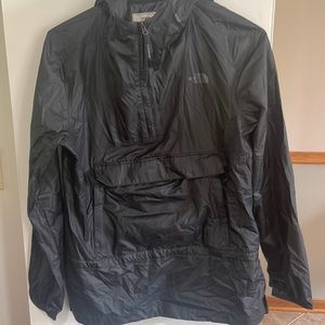 North face light windbreaker. Half zip hooded. Pocket side zippers.